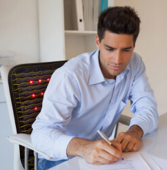 Man behind his desk on a healthyline jet chair mat