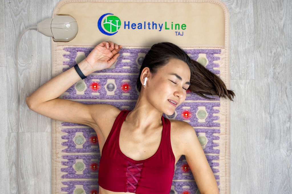 Woman sweating on a HealthyLine TAJ mat