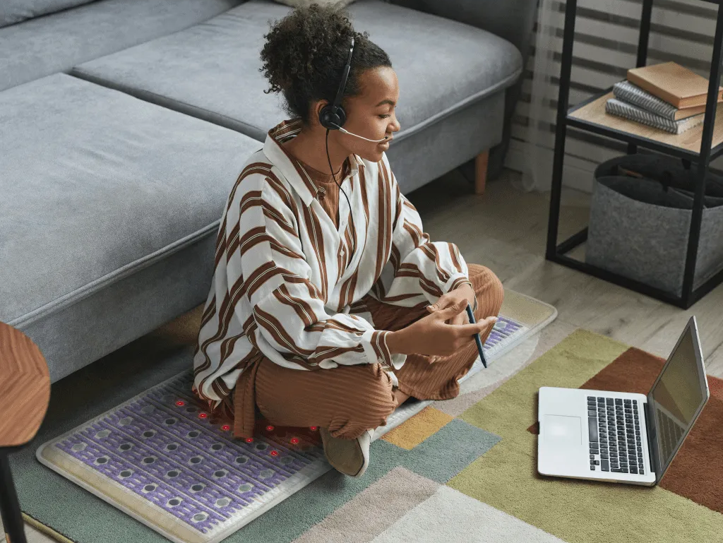 Girl sitting on a Healthyline Taj Mat 6024  on the floor