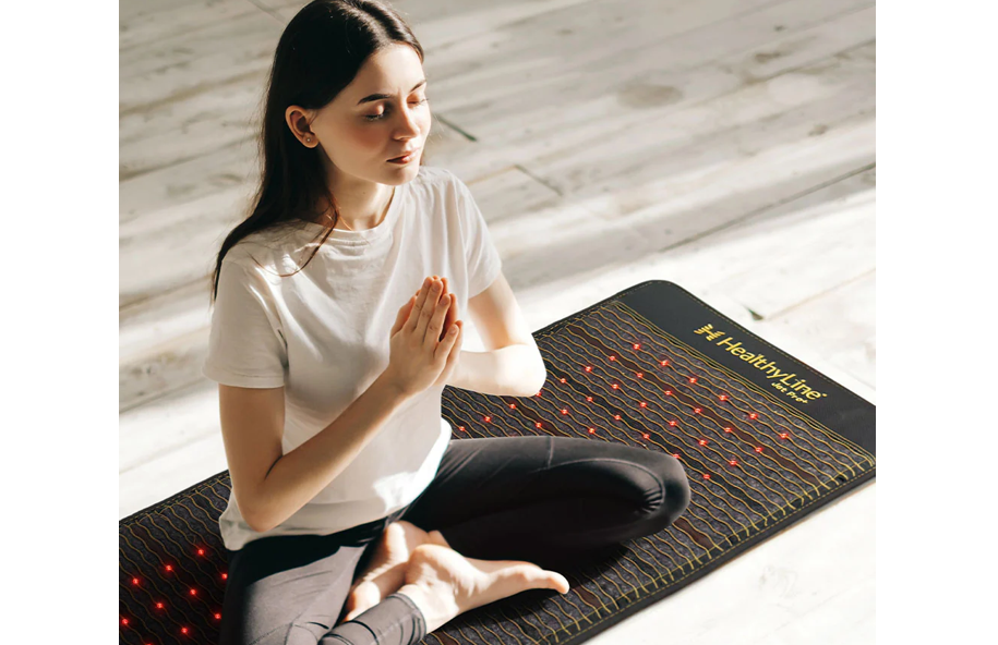 Woman meditating on a HealthyLine Jet mat