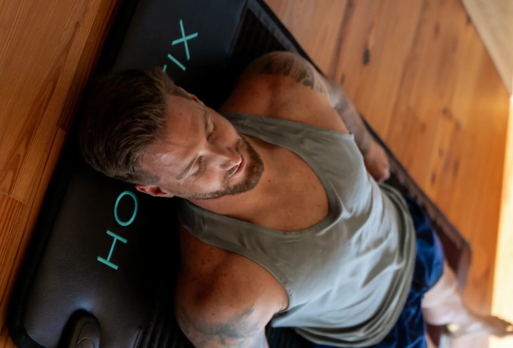 Man relaxing on a Holistix PEMF Mat Man relaxing on a Holistix PEMF Mat