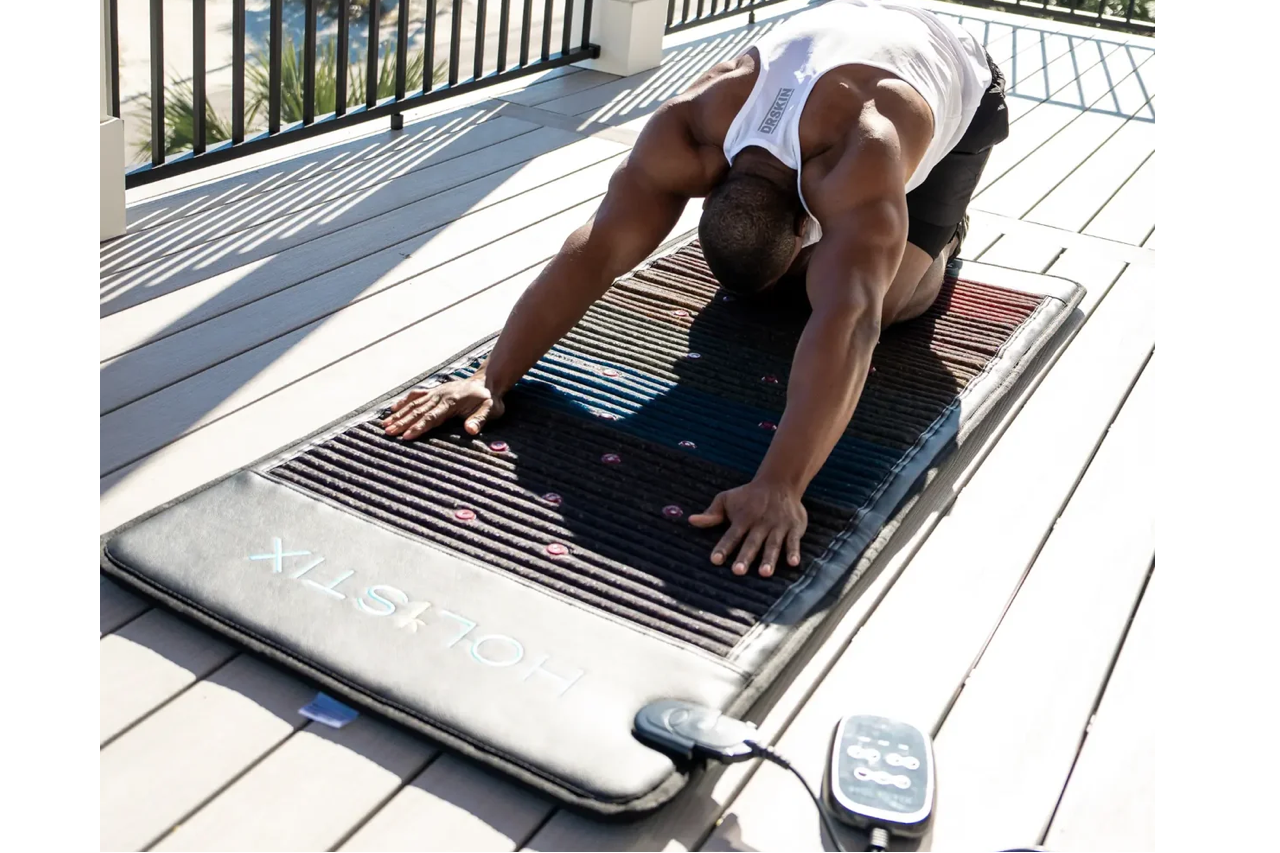 Man stretching on a Holistix Paragon full PEMF Therapy Mat Man stretching on a Holistix Paragon full PEMF Therapy Mat
