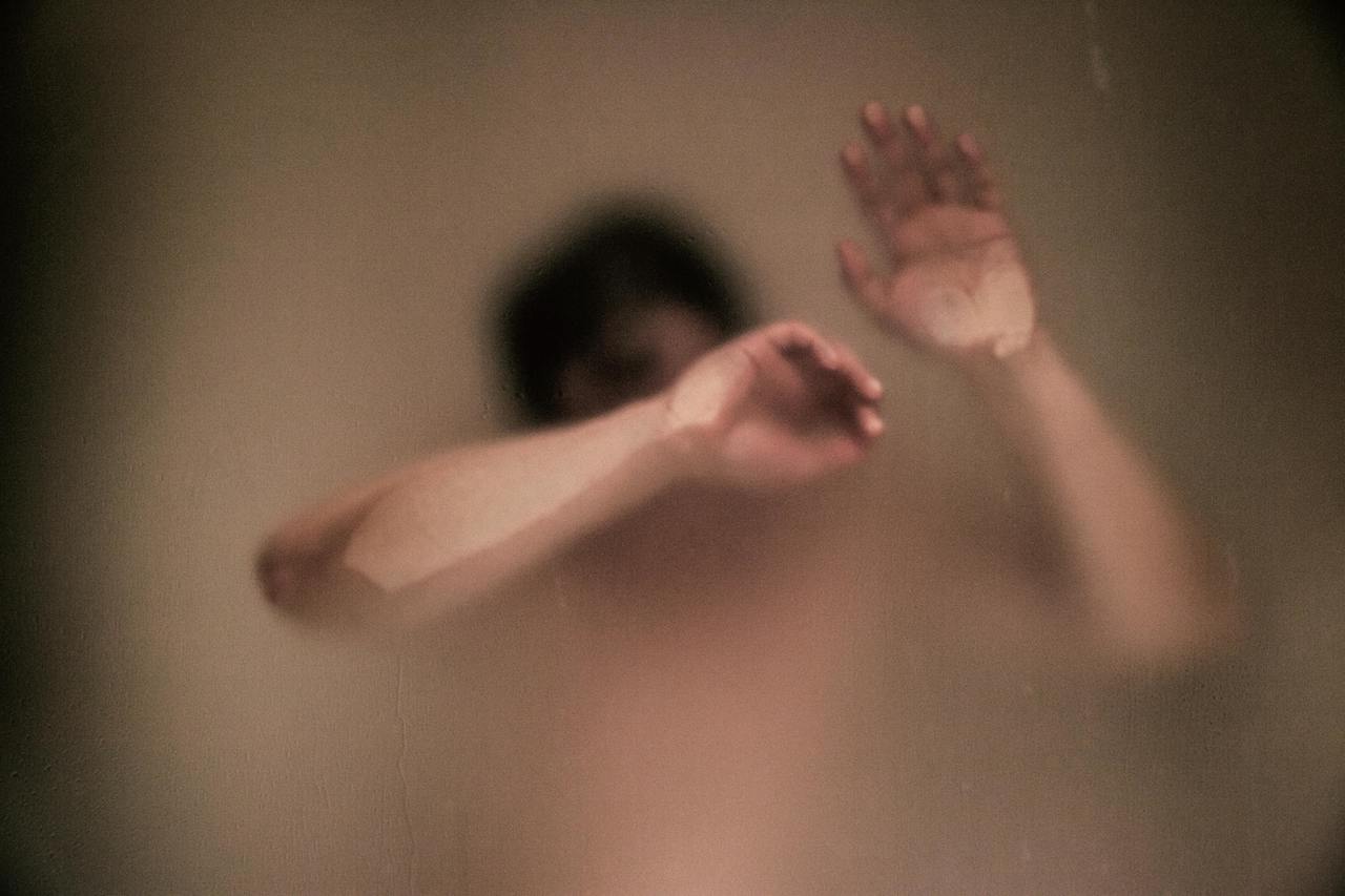 Man taking warm shower after infrared sauna session Man taking warm shower after infrared sauna session