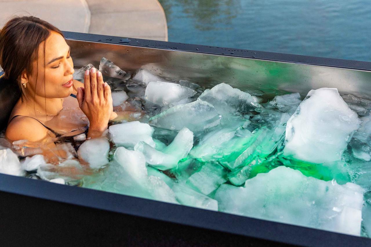 Woman stepping into a cold plunge after a sauna, Nordic tradition. Woman stepping into a cold plunge after a sauna, Nordic tradition.