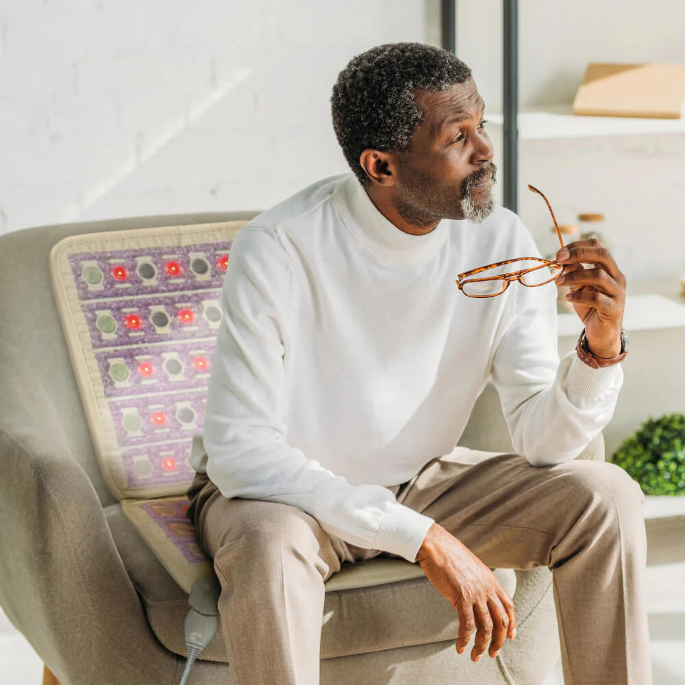 Man sitting on HealthyLine TAJ Chair mat