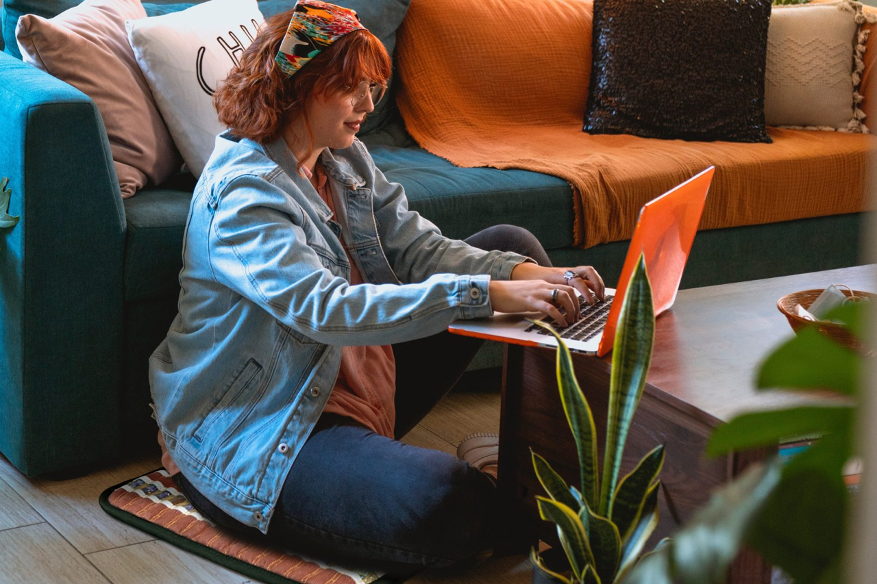 Woman sitting on a TAO mat 1818 Photon on the floor