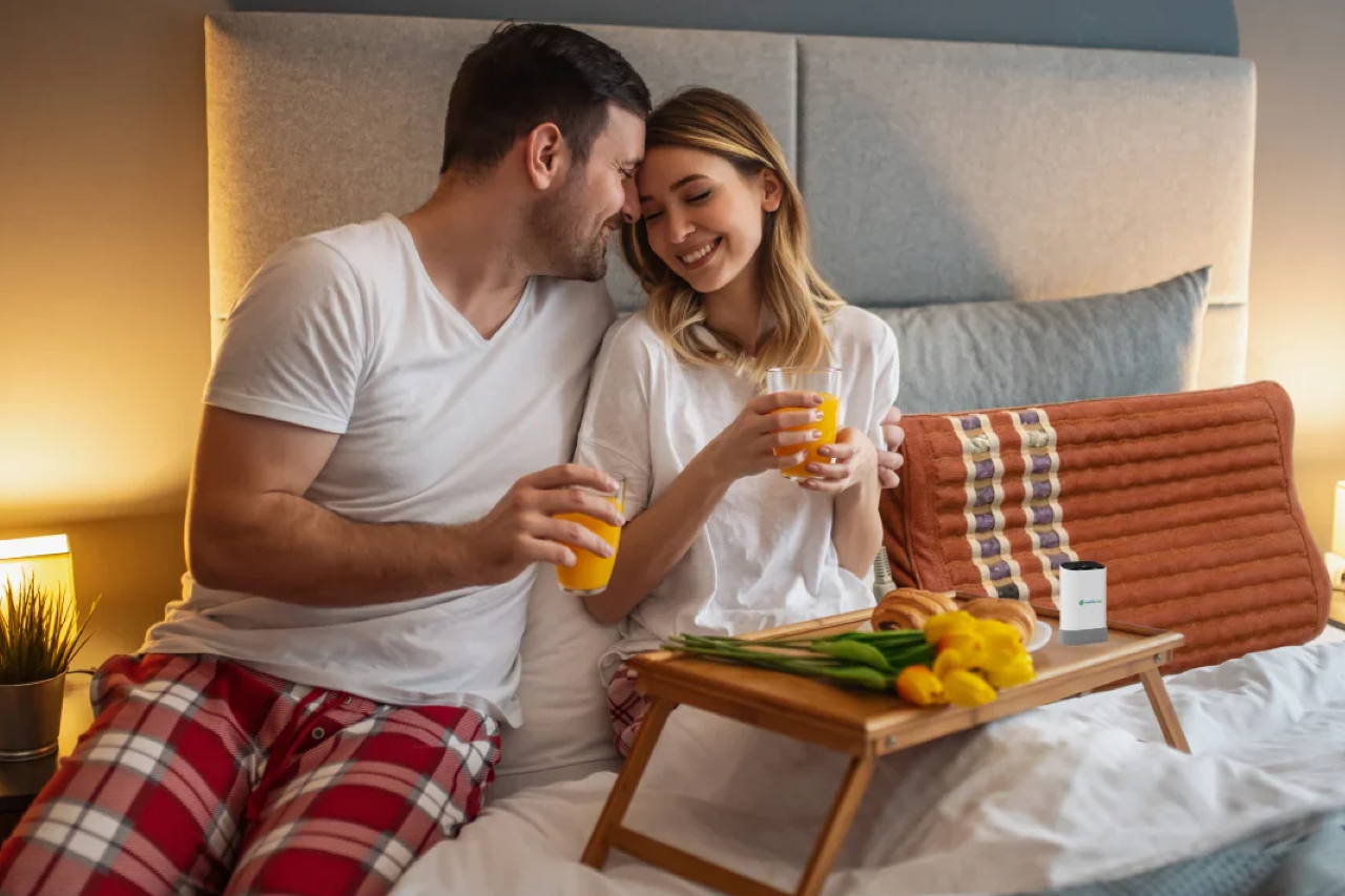 Couple in bed, using the HealthyLine TAO Pillow