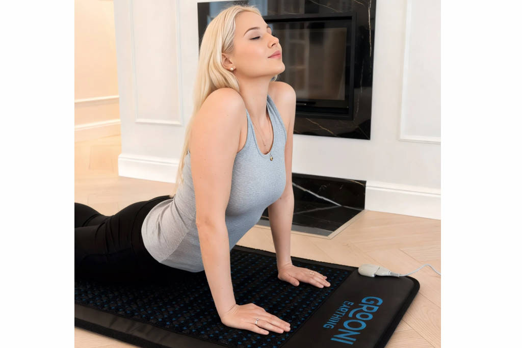 woman on grooni pemf therapy mat woman on grooni pemf therapy mat